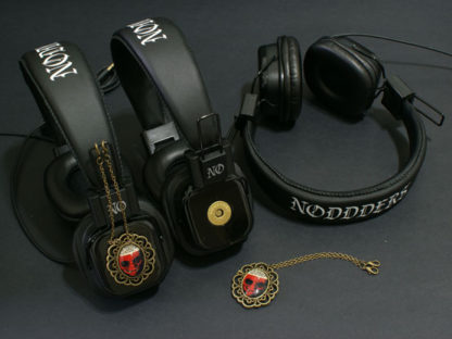Headphones with vampire character pendants